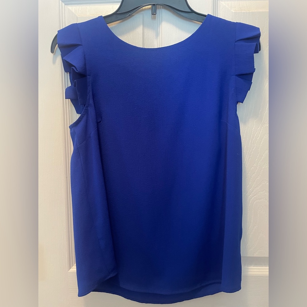 Blue top size small. Never worn and in great condition